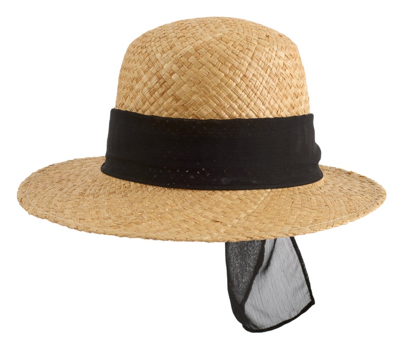 May include: A straw hat with a wide brim and a black ribbon around the crown. The ribbon has a long tail that hangs down the back of the hat.