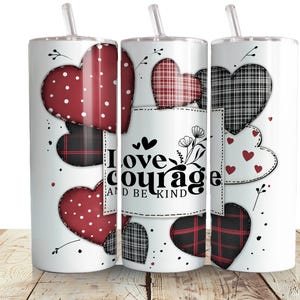 May include: Three stainless steel tumblers with a white background and a patchwork heart design. The tumblers feature the text "Love courage and be kind".
