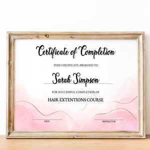 May include: A pink and gold certificate of completion for a hair extensions course, awarded to Sarah Simpson.