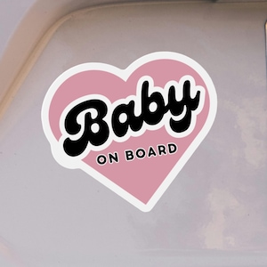 Cute baby on board sticker on bumper of white car