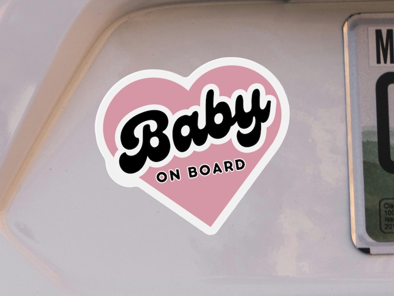 Cute baby on board sticker on bumper of white car