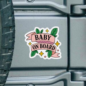 Vinyl Baby On Board decal sticker shown on a smooth SUV surface