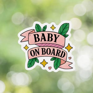 Baby On Board sign with whimsical pink ribbon and nature-inspired graphics