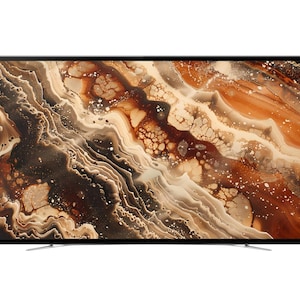 May include: A flat-screen television with a thin black frame and a stand, displaying an abstract digital image of swirling brown, tan, and cream-colored patterns that resemble the texture of polished agate or marble stone with white speckles.