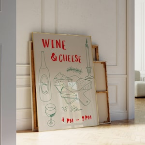 Puede incluir: Un póster enmarcado en dorado con el texto "Wine & Cheese" en letras verdes y rojas. El póster también presenta una botella de vino, un plato de queso y una vela. El texto "4 PM - 9 PM" está en la parte inferior del póster.