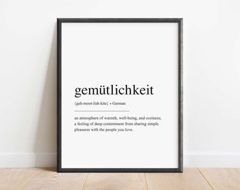 May include: Black and white printable wall art with the German word "gemütlichkeit" and its definition: "an atmosphere of warmth, well-being, and cosiness; a feeling of deep contentment from sharing simple pleasures with the people you love."