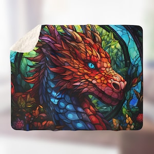 May include: A stained glass style illustration of a red dragon's head with blue eyes, surrounded by colourful foliage.