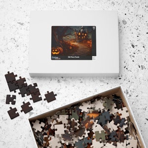 May include: A 520 piece jigsaw puzzle featuring a spooky Halloween scene with a haunted house, jack-o-lanterns, and a path leading to the house. The puzzle box is white with a picture of the puzzle on the front and the words "Custom Made" and "520 Piece Puzzle".