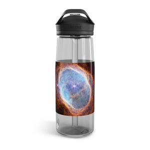 May include: A clear plastic water bottle with a black lid and a colorful nebula design. The bottle is made by Camelbak.