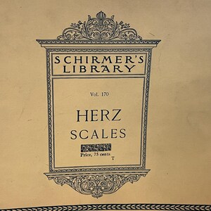 May include: A vintage book cover from Schirmer's Library, Vol. 170, featuring the title "HERZ SCALES" in bold, black lettering. The cover has an ornate frame and decorative elements, with the text "SCHIRMER'S LIBRARY" at the top.