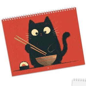 May include: A spiral-bound wall calendar featuring a graphic illustration of a black cat with large eyes holding wooden chopsticks over a bowl, with a piece of sushi nearby, all set against a solid, vibrant red background.