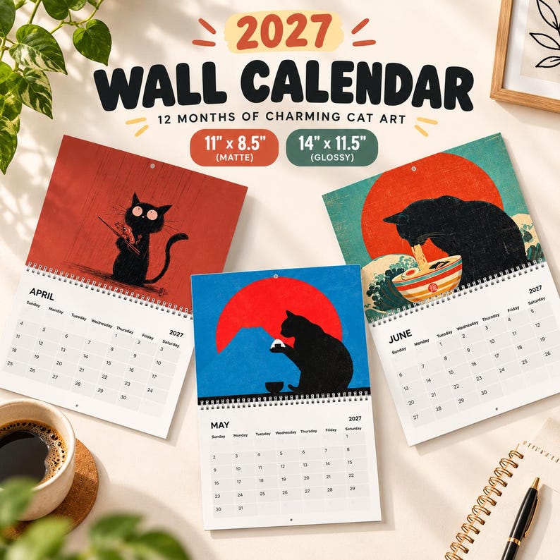 May include: A 2027 wall calendar featuring cat art, with pages for April, May, and June. The calendar is available in 27.9 by 21.6 cm matte and 35.6 by 29.2 cm glossy sizes. Each page displays a black cat illustration and a monthly grid.
