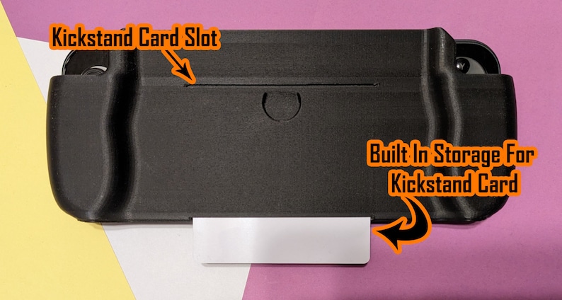 May include: Black protective case for a Nintendo Switch with a built-in storage slot for a kickstand card. The case has a slot for the kickstand card and a built-in storage compartment for the card.