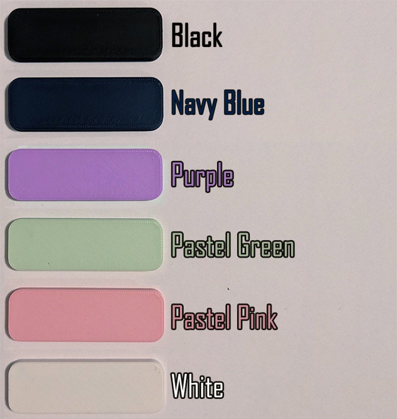 May include: Six color swatches of paint samples. The colors are black, navy blue, purple, pastel green, pastel pink, and white.