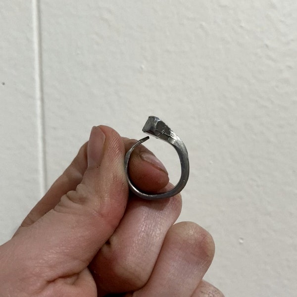 Farrier's horseshoe nail ring