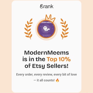 May include: A white rectangular graphic featuring the text Erank at the top, a central circular logo with a hand holding a crystal ball, and orange laurel branches. Below, the text reads ModernMeems is in the Top 10% of Etsy Sellers! Every order, every review, every bit of love &mdash; it all counts! with a fire emoji.