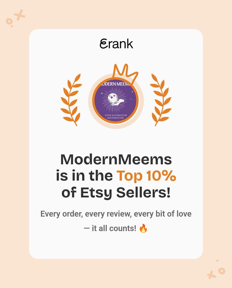 May include: A white rectangular graphic featuring the text Erank at the top, a central circular logo with a hand holding a crystal ball, and orange laurel branches. Below, the text reads ModernMeems is in the Top 10% of Etsy Sellers! Every order, every review, every bit of love &mdash; it all counts! with a fire emoji.