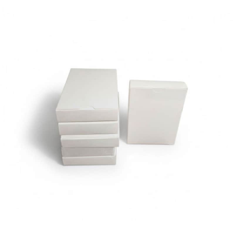 May include: A stack of four rectangular white cardboard boxes positioned vertically, accompanied by a single matching white rectangular box standing upright to the right. Each box features a plain, smooth surface with no visible markings or text.