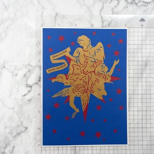 Christmas card shown on inch grid mat to show size