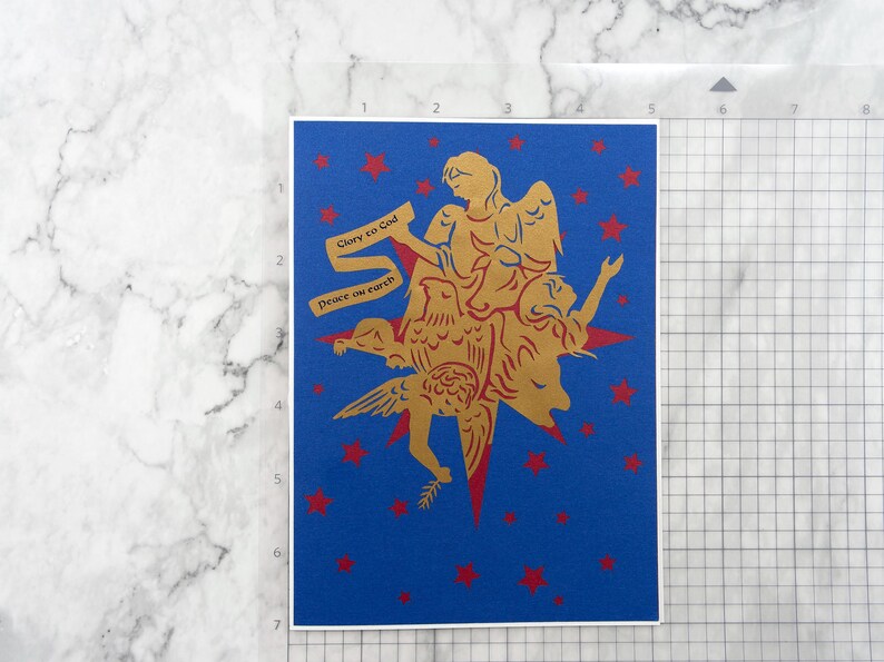 Christmas card shown on inch grid mat to show size