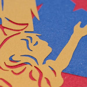Detail of paper cut angel in greeting card design