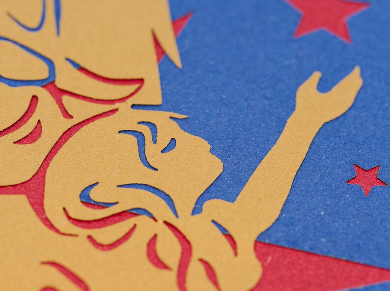 Detail of paper cut angel in greeting card design