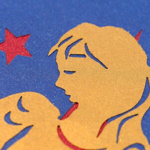 Detail of paper cut angel on Christmas card