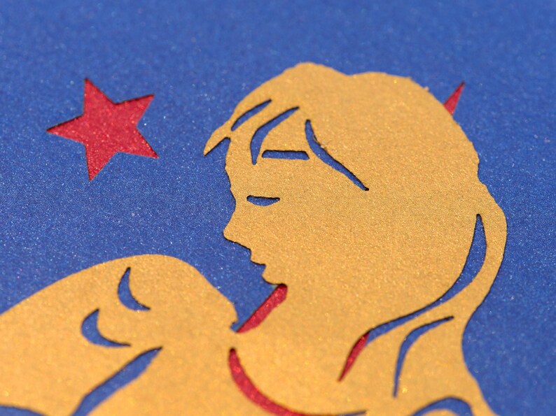 Detail of paper cut angel on Christmas card