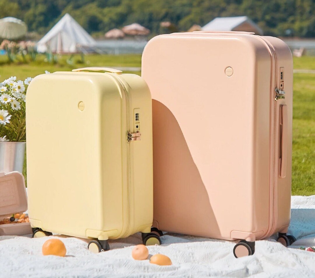 Pastel Colored Suitcases With Four Wheels and Matching Colored Zippers for Travel and School