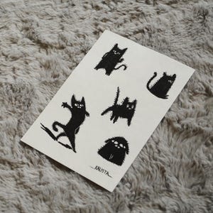 Feuille d'autocollants lunatiques mats de chat noir : art meme kawaii pour les cadeaux et la décoration des amoureux des animaux, art original cadeau personnalisé
