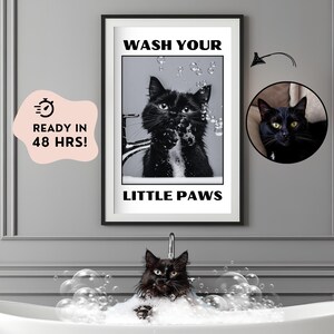 May include: A black and white poster with the text "Wash Your Little Paws" and a black cat with soap bubbles around it. The cat is looking at the camera.