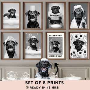 May include: A set of eight framed black and white prints showcasing a black Labrador Retriever in bathroom settings. The prints include the text "WASH YOUR LITTLE PAWS" and "SET OF 8 PRINTS READY IN 48 HRS!"