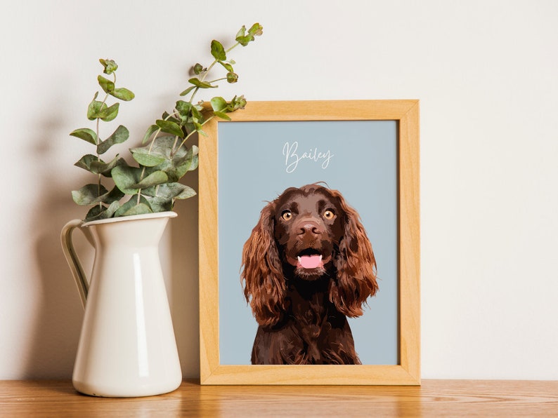 Depicts a cute cocker spaniel. The dog is sitting on a blue background and has its front paw raised. The dog has big, brown eyes and soft, shaggy fur.