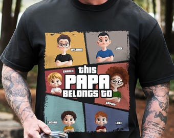 May include: A black t-shirt featuring a graphic design with six cartoon characters in individual panels. The text reads "this PAPA BELONGS TO" with the names William, Jack, Charlie, Sophia, Lucian, and Luke printed next to each character.