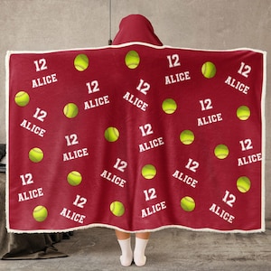 May include: Red hooded fleece blanket with a repeating pattern of yellow softball and the text "12 ALICE".