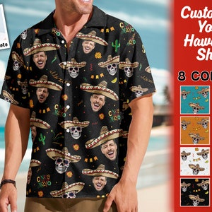 May include: A black button-up shirt with a colorful pattern of skulls, sombreros, and the text "Cinco de Mayo".