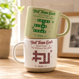 May include: Two ceramic mugs stacked vertically. The top mug is light green with dark green text reading Best Team Ever, Never Forget The Difference You Make, a crossword-style grid with names Chloe, Linda, Diana, Susan, and the year 2026. The bottom mug is white with red text reading Best Team Ever, Never Forget The Difference You Make, a crossword-style grid with names Daniel, Sarah, Jack, Linda, Poppy, Tracy, and the year 2026.