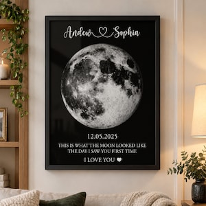 May include: A framed black and white wall art print featuring a detailed lunar surface image. The text reads: Andew Sophia, 12.05.2025, THIS IS WHAT THE MOON LOOKED LIKE THE DAY I SAW YOU FIRST TIME, I LOVE YOU with a heart symbol.
