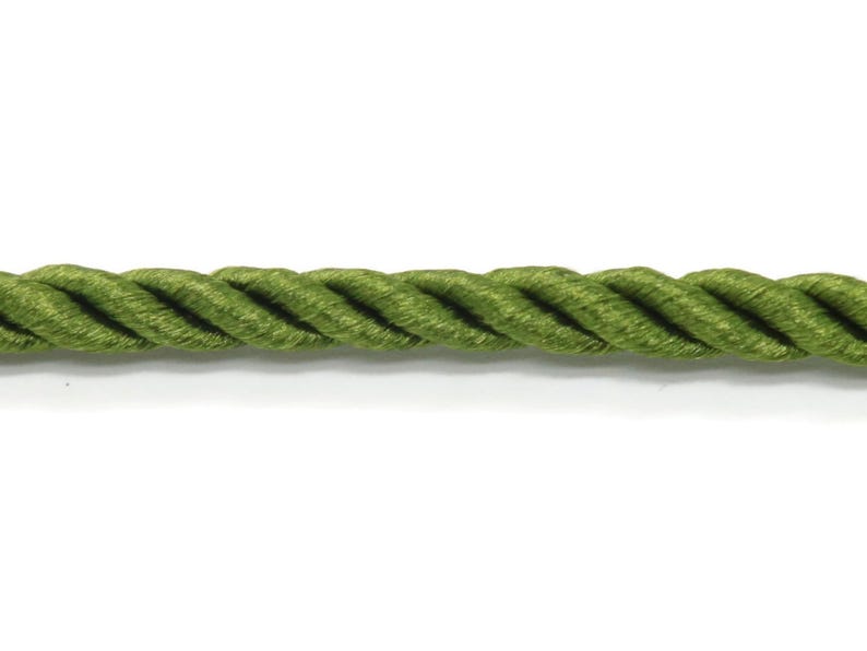 May include: Close-up of a length of olive green twisted rope. The rope is thick and has a textured appearance. The background is plain white, highlighting the rope's color and texture. This rope could be used for various craft projects.