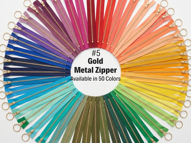 May include: A vibrant display of metal zippers in a rainbow of colors, arranged in a circular pattern. Each zipper has a gold pull and is available in a variety of shades, including red, orange, yellow, green, blue, and purple. The text reads "#5 Gold Metal Zipper Available in 50 Colors."