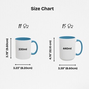 May include: Size chart for two mugs with blue rims. The 11 ounce mug is 3.78 inches tall and 3.23 inches wide, and holds 330 milliliters. The 15 ounce mug is 4.76 inches tall and 3.39 inches wide, and holds 440 milliliters.