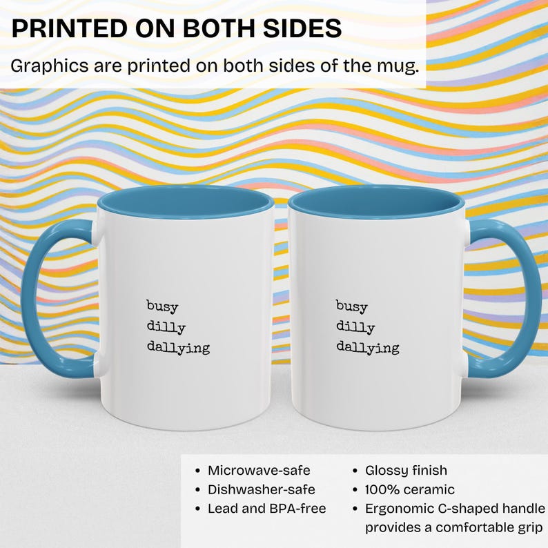 May include: White ceramic mug with a light blue rim and handle. The mug has the text "busy dilly dallying" printed on both sides. The mug is microwave, dishwasher, and lead and BPA free. It has a glossy finish and an ergonomic C-shaped handle.