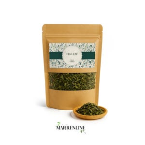 May include: A brown kraft paper stand-up pouch containing dried green fig leaves. The label features a white scalloped frame with the text FIG LEAF and FICUS CARICA over a botanical pattern. A small wooden bowl holds a portion of the dried leaves.