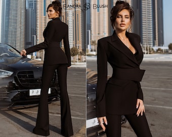 Black 2-Piece Formal Pantsuit For Women With Elongated Deep V Jacket, Wide Belt And High Waisted Flared Pants. Rehearsal Dinner Suit