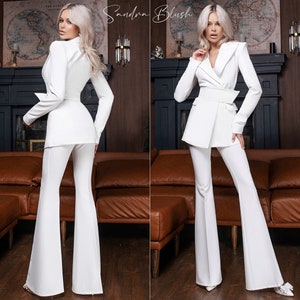 White 2-Piece Formal Pantsuit For Women With Elongated Deep V Jacket, Wide Belt And High Waisted Flared Pants. Bridal, Rehearsal Dinner Suit