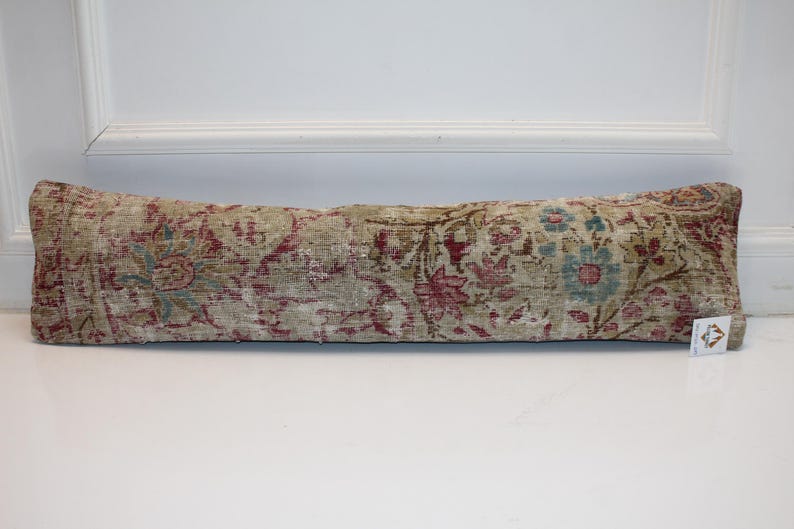 Elegant, Warm, Unique
A one-of-a-kind lumbar pillow with soft artistic details.