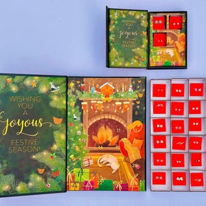a festive holiday-themed box with a card and earrings, as well as a set of red boxes with earrings inside.
