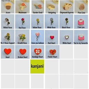 a bunch of different types of brooches on a table