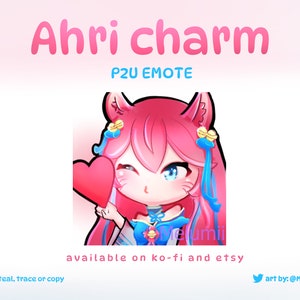 May include: A pink and blue cartoon fox character with cat ears, holding a red heart, with the text "Ahri charm P2U EMOTE available on ko-fi and etsy art by: @Melumii_"
