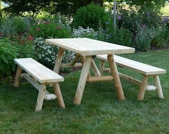 Picnic table made of white cedar with seperate benches included